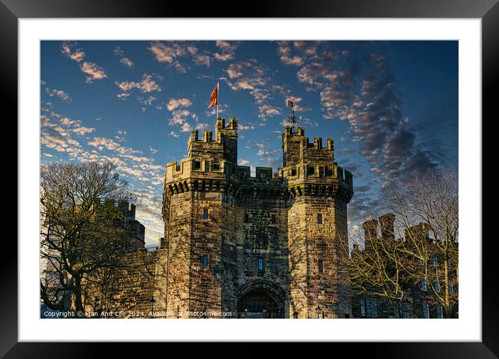 Historic stone castle with towers against a blue sky with scattered clouds at sunset in Lancaster. Framed Mounted Print by Man And Life