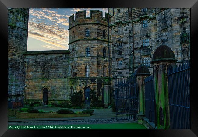 Historic stone castle at dusk with dramatic sky and greenery, suitable for travel and history themes in Lancaster. Framed Print by Man And Life