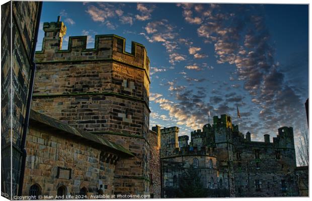 Medieval castle at dusk with dramatic sky and clouds in Lancaster. Canvas Print by Man And Life