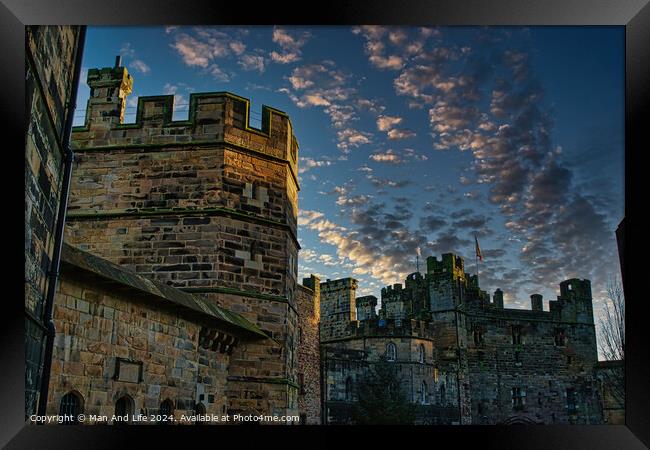 Medieval castle at dusk with dramatic sky and clouds in Lancaster. Framed Print by Man And Life