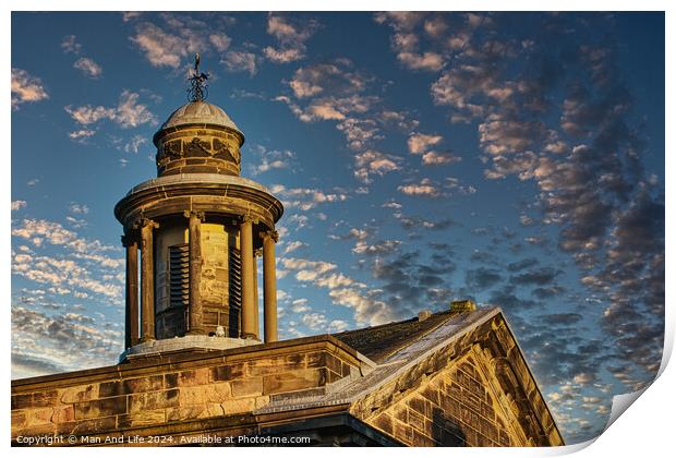 Historic stone building with a dome under a blue sky with scattered clouds at sunset in Lancaster. Print by Man And Life