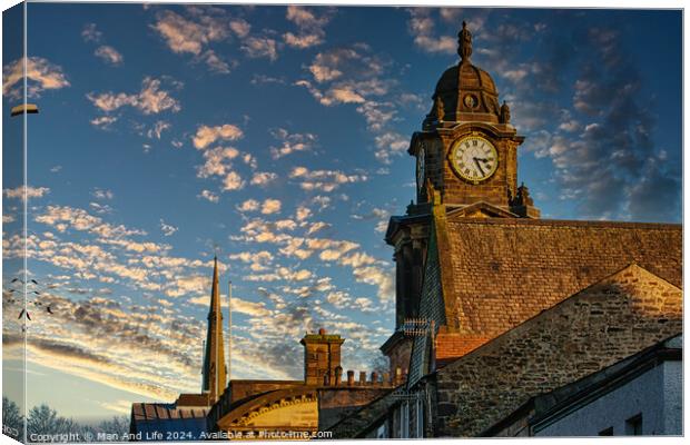 Historic clock tower against a vibrant sunset sky with scattered clouds in Lancaster. Canvas Print by Man And Life