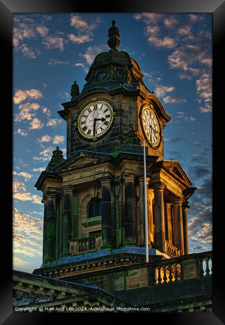 Historic clock tower against a dramatic sky at dusk, showcasing intricate architecture and timeless design in Lancaster. Framed Print by Man And Life