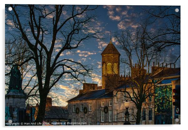 Historic stone building with a clock tower at dusk, silhouetted trees, and a vibrant sky in Lancaster. Acrylic by Man And Life