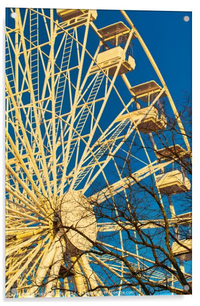 Ferris wheel against a clear blue sky with sunlight casting shadows, conveying a sense of leisure and entertainment in Lancaster. Acrylic by Man And Life