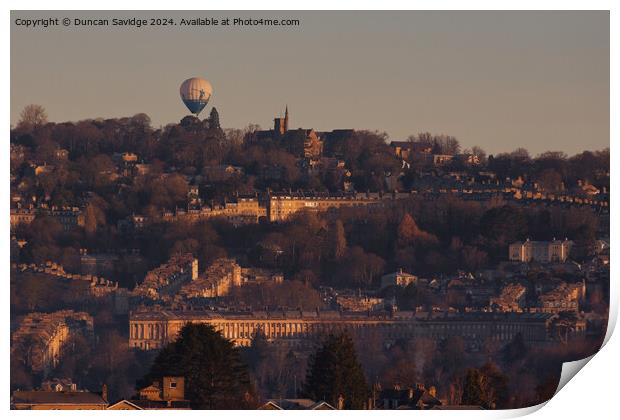 Hot air balloon floats over the golden Royal Crescent in winter  Print by Duncan Savidge