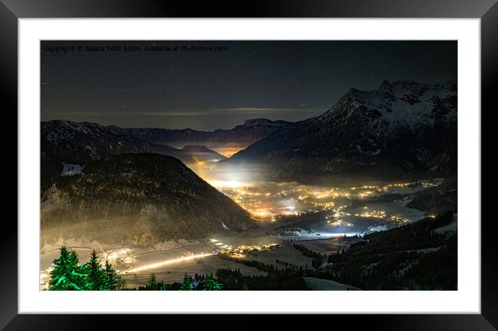 Village between the mountains at night Framed Mounted Print by Balázs Tóth