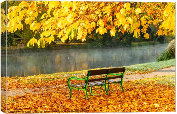 Godmanchester Bench in Autumn Canvas Print by Keith Douglas