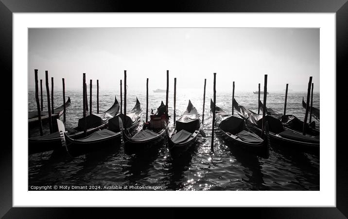 Gondolas docked on a Venetian canal  Framed Mounted Print by Moty Dimant