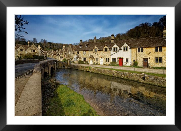 The bridge over the river in the picturesque village of Castle Combe in the Cotswolds Wiltshire UK Framed Mounted Print by John Gilham