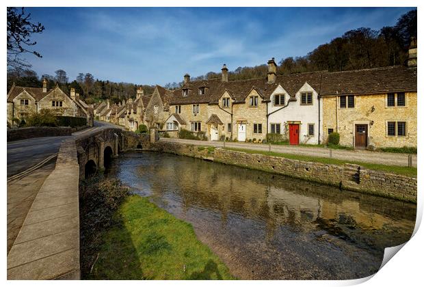 The bridge over the river in the picturesque village of Castle Combe in the Cotswolds Wiltshire UK Print by John Gilham