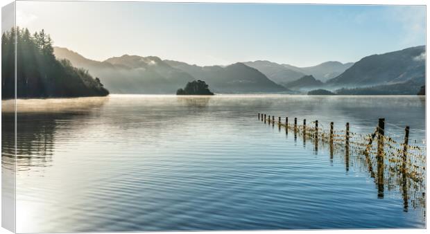 Derwent Water and early morning sunrays Canvas Print by Julian Carnell