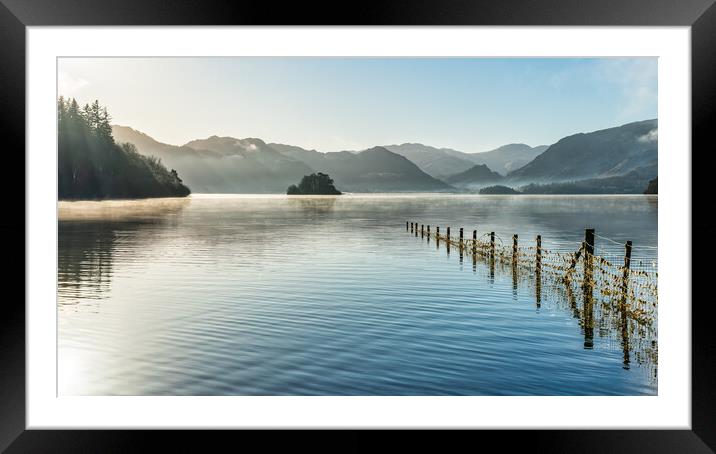Derwent Water and early morning sunrays Framed Mounted Print by Julian Carnell