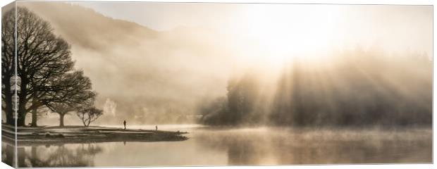 Panorama misty Derwent Water with amazing sunrays Canvas Print by Julian Carnell