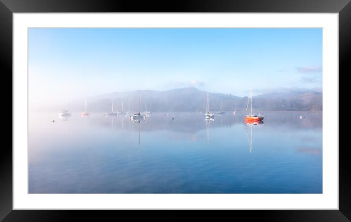 Sailing Boats on Windermere on a winters morning with mist and sun glow Framed Mounted Print by Julian Carnell