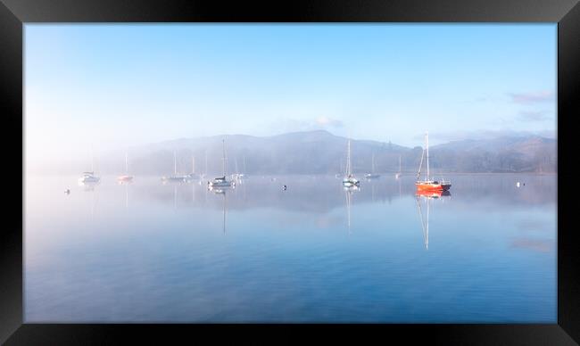 Sailing Boats on Windermere on a winters morning with mist and sun glow Framed Print by Julian Carnell