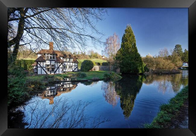 Reflections in the stream Loose Village in Kent UK Framed Print by John Gilham