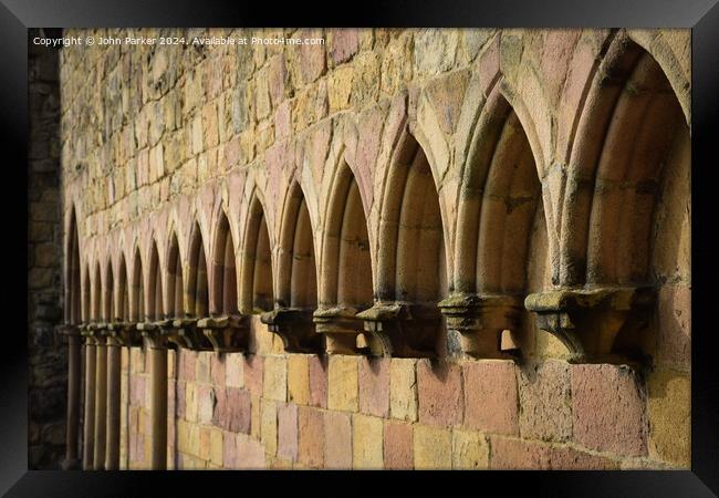 Building arches Framed Print by John Parker