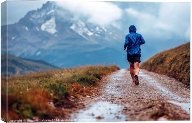 A mountain runner enjoys the trails, a day of rain Canvas Print by Joaquin Corbalan