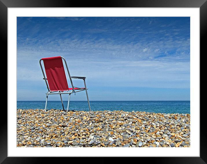 Waiting at Weybourne- Red Chair left on the Beach Framed Mounted Print by john hartley
