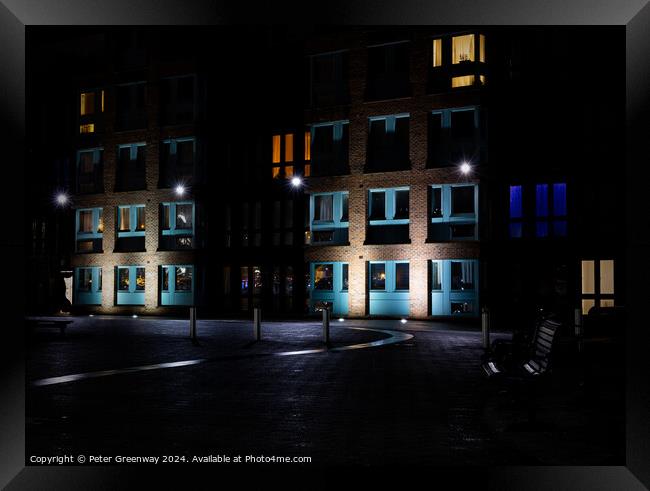 Seating Outside Illuminated Apartments At The Historic Docks At  Framed Print by Peter Greenway