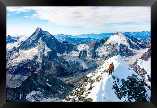 Alpine climbers on a mountain Framed Print by Julian Carnell