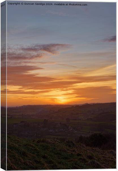 Portrait of the winter sunset over Englishcombe  Canvas Print by Duncan Savidge