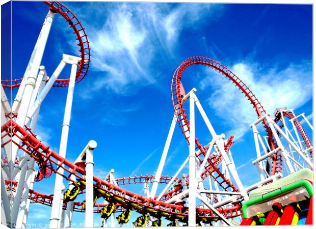 Roller coaster against blue sky. Canvas Print by john hill