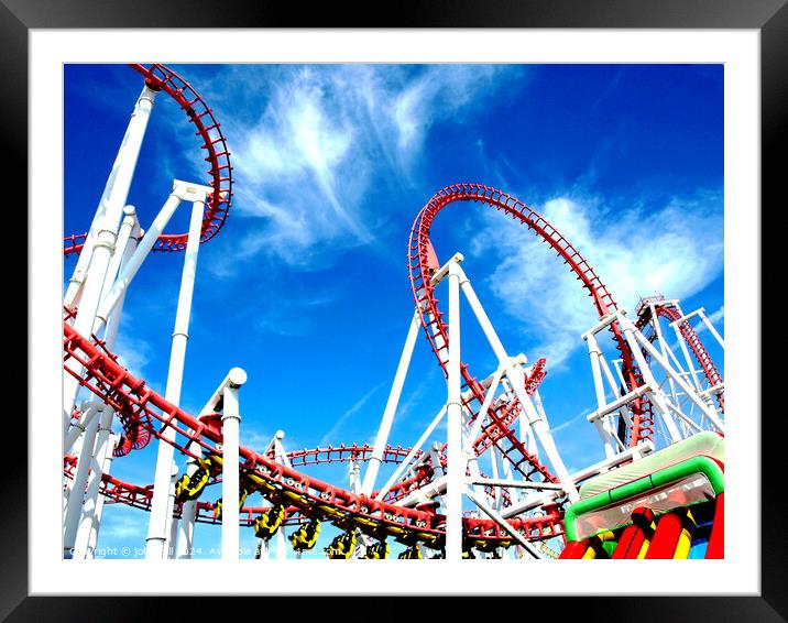 Roller coaster against blue sky. Framed Mounted Print by john hill