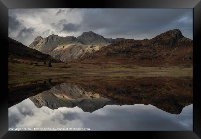 Moody reflections in Blea Tarn, Lake District, Eng Framed Print by Paul Edney
