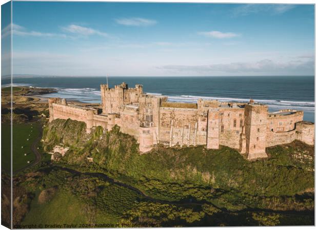 Aerial View of Bamburgh Castle, Northumberland Canvas Print by Bradley Taylor