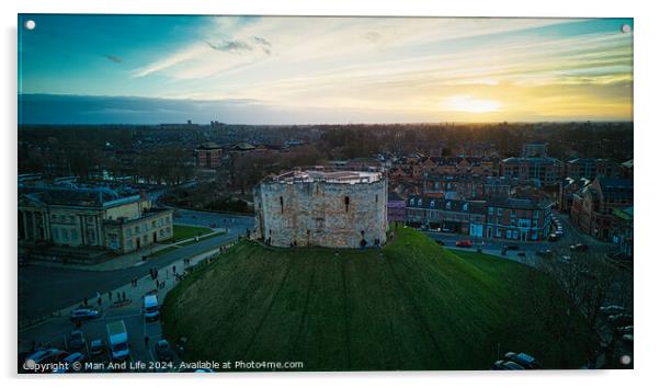 Aerial view of a historic castle at sunset with surrounding cityscape and dramatic sky in York, North Yorkshire Acrylic by Man And Life