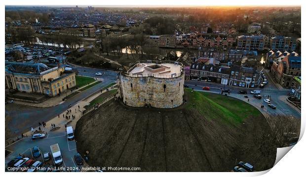 Aerial view of a historic circular stone fortress at dusk, with surrounding urban landscape and sunset sky in York, North Yorkshire Print by Man And Life