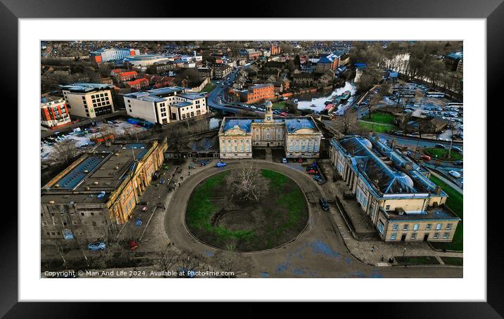 Aerial view of a historic circular stone fortress at dusk, with surrounding urban landscape and sunset sky in York, North Yorkshire Framed Mounted Print by Man And Life