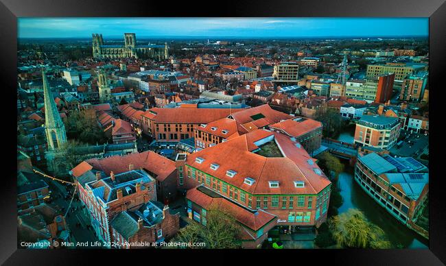 Aerial view of a historic city at dusk with prominent buildings and a clear sky in York, North Yorkshire Framed Print by Man And Life