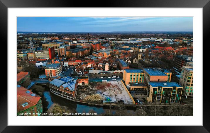 Aerial view of a modern cityscape during sunset with buildings and a river in York, North Yorkshire Framed Mounted Print by Man And Life