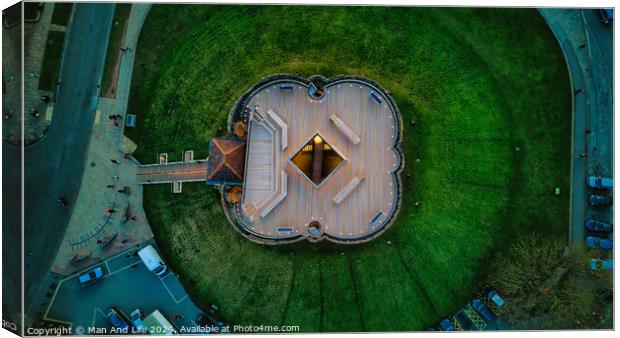Aerial view of a unique star-shaped building surrounded by green lawns at dusk in York, North Yorkshire Canvas Print by Man And Life