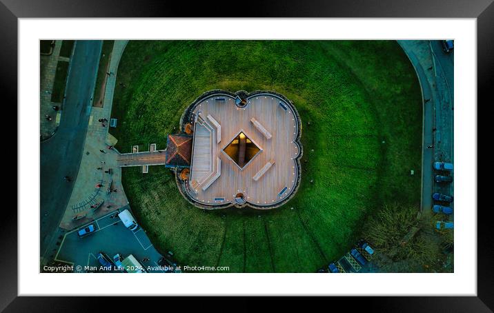 Aerial view of a unique star-shaped building surrounded by green lawns at dusk in York, North Yorkshire Framed Mounted Print by Man And Life