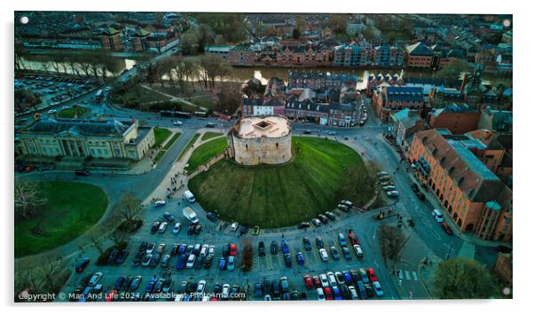 Aerial view of a historic building with a circular shape surrounded by a green lawn, parking area, and cityscape during twilight in York, North Yorkshire Acrylic by Man And Life