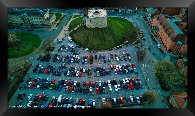 Aerial view of a circular building surrounded by a parking lot with colorful cars, showcasing urban planning and architecture in York, North Yorkshire Framed Print by Man And Life