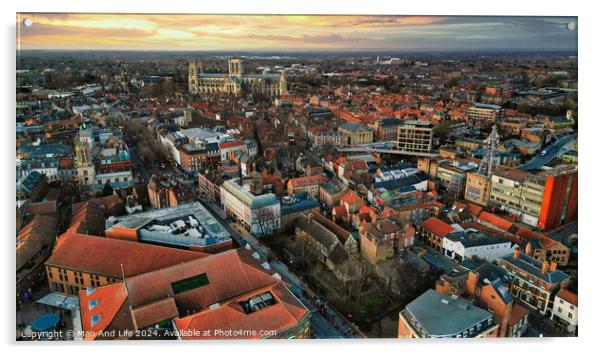 Aerial view of a European city at sunset with warm lighting, showcasing historic buildings and urban landscape in York, North Yorkshire Acrylic by Man And Life