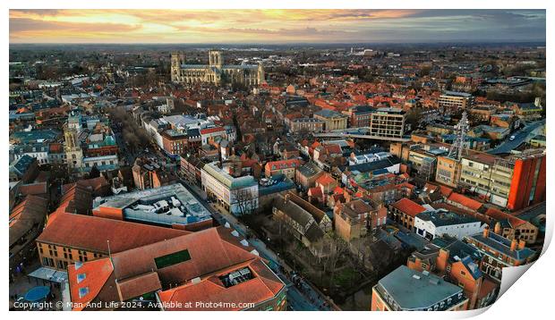 Aerial view of a European city at sunset with warm lighting, showcasing historic buildings and urban landscape in York, North Yorkshire Print by Man And Life
