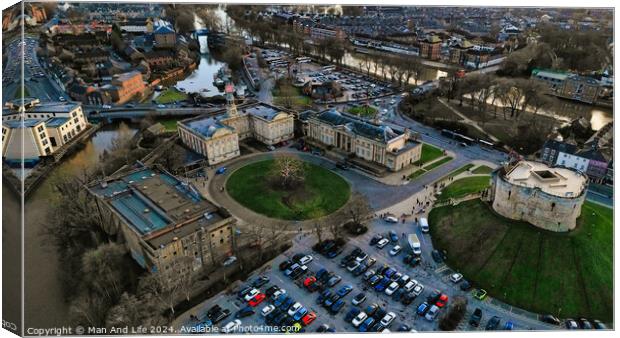 Aerial view of a historic castle with surrounding park and adjacent parking lot in an urban setting at dusk in York, North Yorkshire Canvas Print by Man And Life
