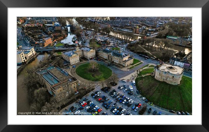 Aerial view of a historic castle with surrounding park and adjacent parking lot in an urban setting at dusk in York, North Yorkshire Framed Mounted Print by Man And Life