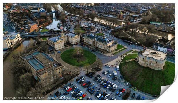 Aerial view of a historic castle with surrounding park and adjacent parking lot in an urban setting at dusk in York, North Yorkshire Print by Man And Life