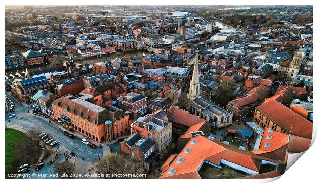 Aerial view of a historic town at dusk with warm lighting, showcasing the urban architecture and streets in York, North Yorkshire Print by Man And Life