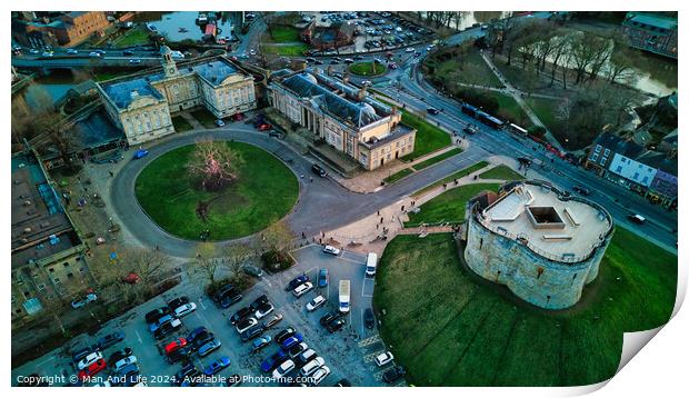 Aerial view of a historic cityscape with a roundabout, ancient buildings, and a fortress at dusk in York, North Yorkshire Print by Man And Life