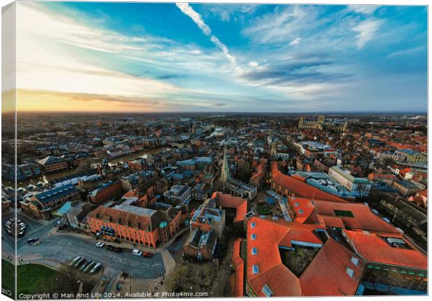 Aerial view of a European city at dusk with historic buildings and a dramatic sky in York, North Yorkshire Canvas Print by Man And Life