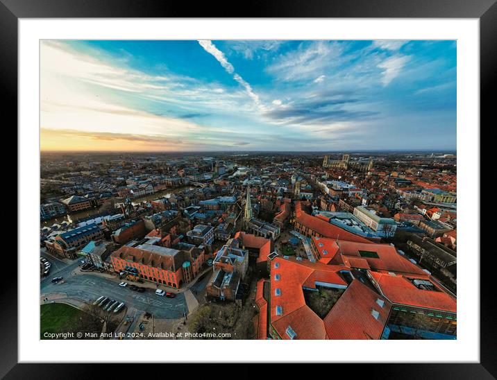 Aerial view of a European city at dusk with historic buildings and a dramatic sky in York, North Yorkshire Framed Mounted Print by Man And Life
