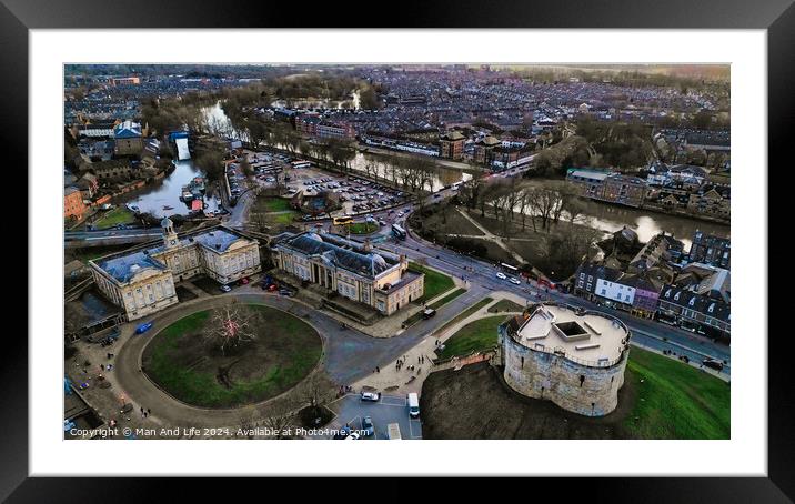 Aerial view of a historic city at dusk with a round tower, buildings, and a river in York, North Yorkshire Framed Mounted Print by Man And Life